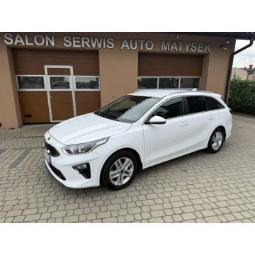 Kia Ceed  Kombi 2019,  1.4 benzyna, automat - Na sprzedaż za 56 900 zł - Orzech - zdjęcie 12